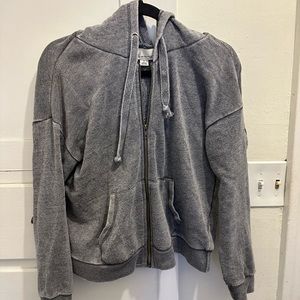 Grey zip up hoodie with brass zipper